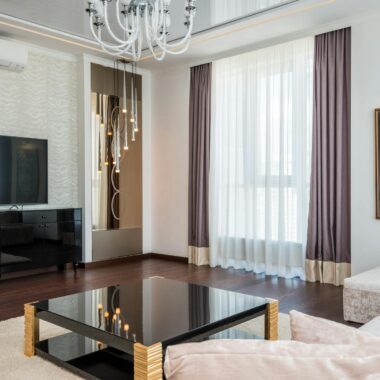 Sleek and stylish modern living room with luxurious furniture and elegant decor.