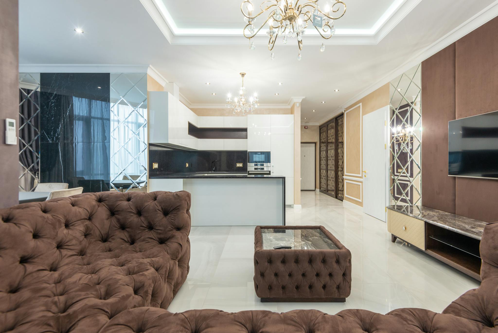Stylish interior of a modern living room featuring plush furniture and elegant lighting.
