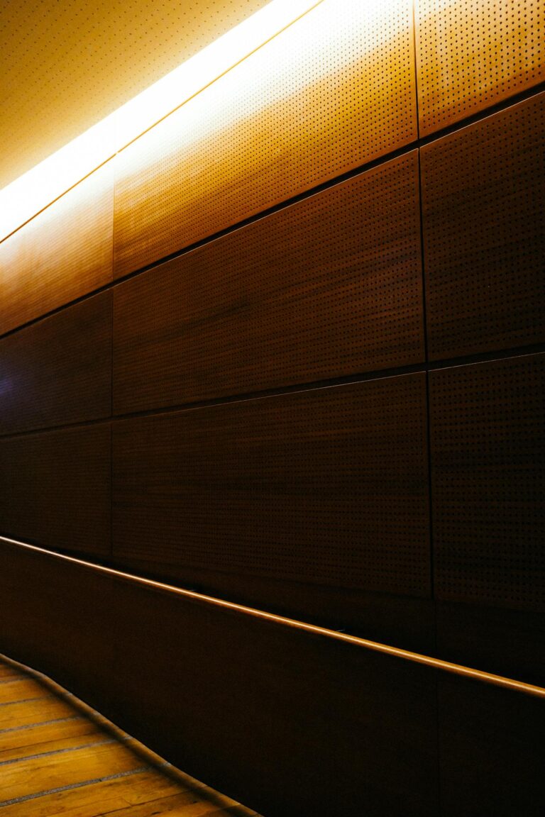 Warm wooden interior design featuring ceiling lighting for an elegant ambiance.